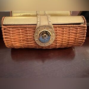 Michael Joe’s gold and straw woven clutch